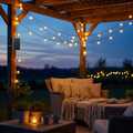 Solar powered LED string lights glowing warmly on an outdoor patio at dusk